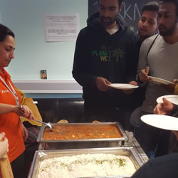 Students being served delicious Indian food at the Diwali celebrations.