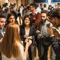 A group of students eating ice-cream and chatting at the LGBT Leaders event.