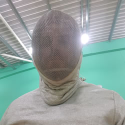 A picture of me wearing the full Sabre equipment including the helmet and faceeguard.