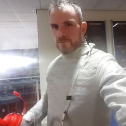 The fencing equipment gets very hot. Here I am wearing it while getting some more water!